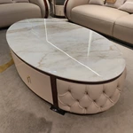 Oval White Marble Coffee Table with Cream Tufted Leather Sides and Two Drawers